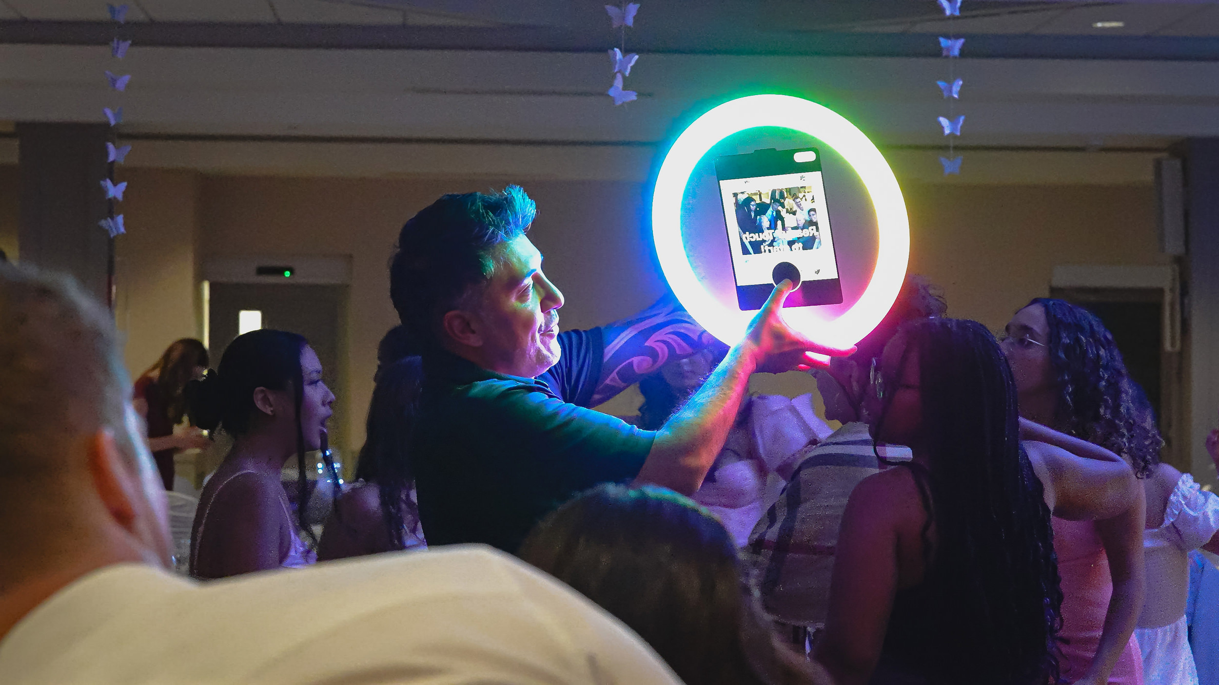 Ring Roamer rainbow glow crowd at party