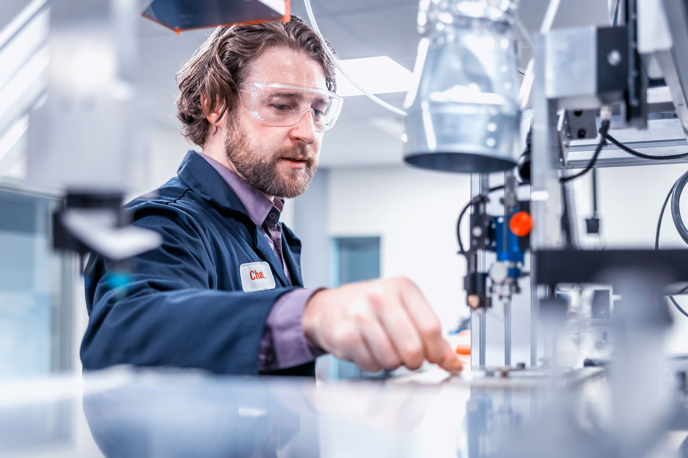 Engineer working with precision machining equipment