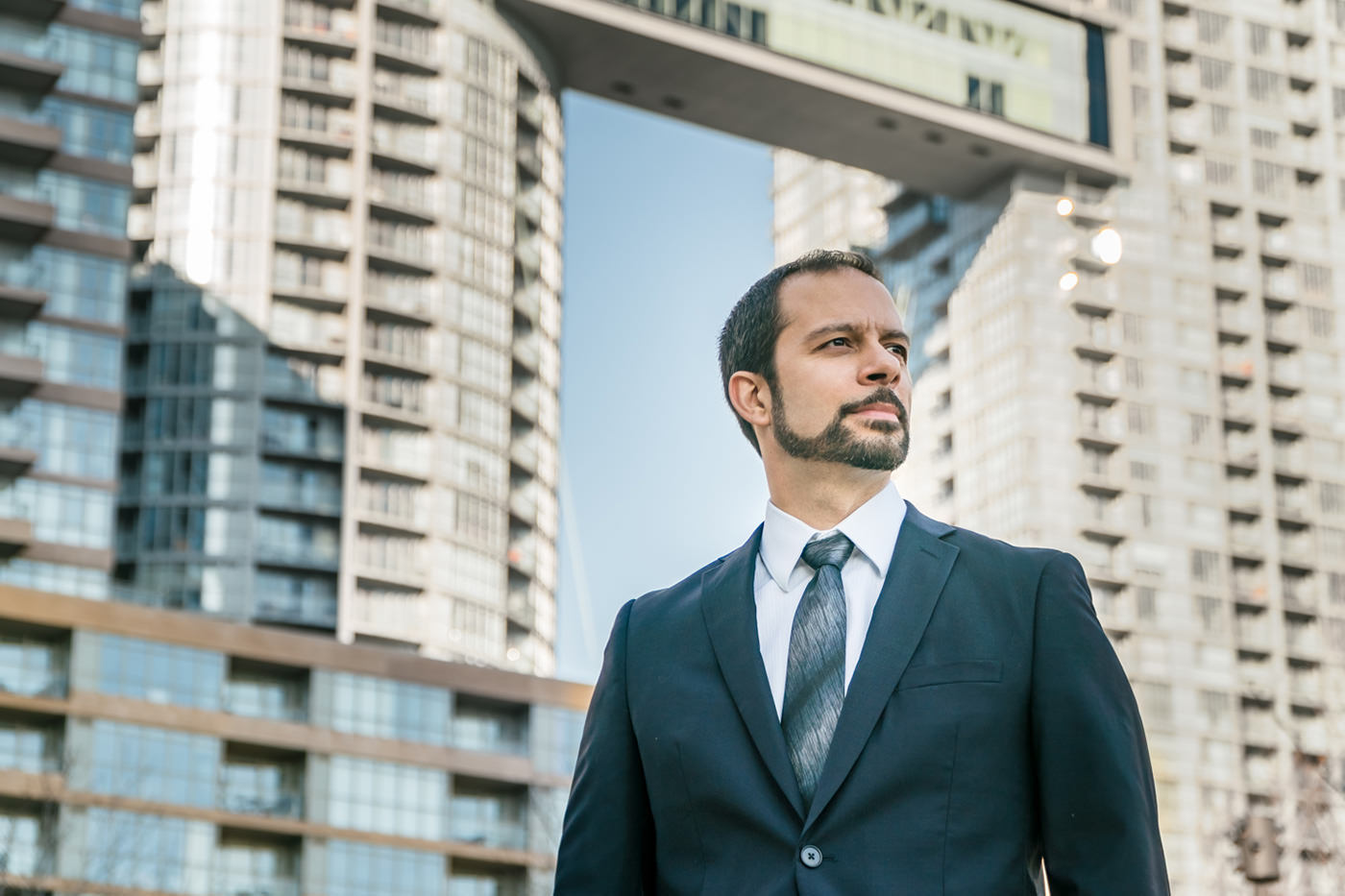 Executive portrait with city skyline background