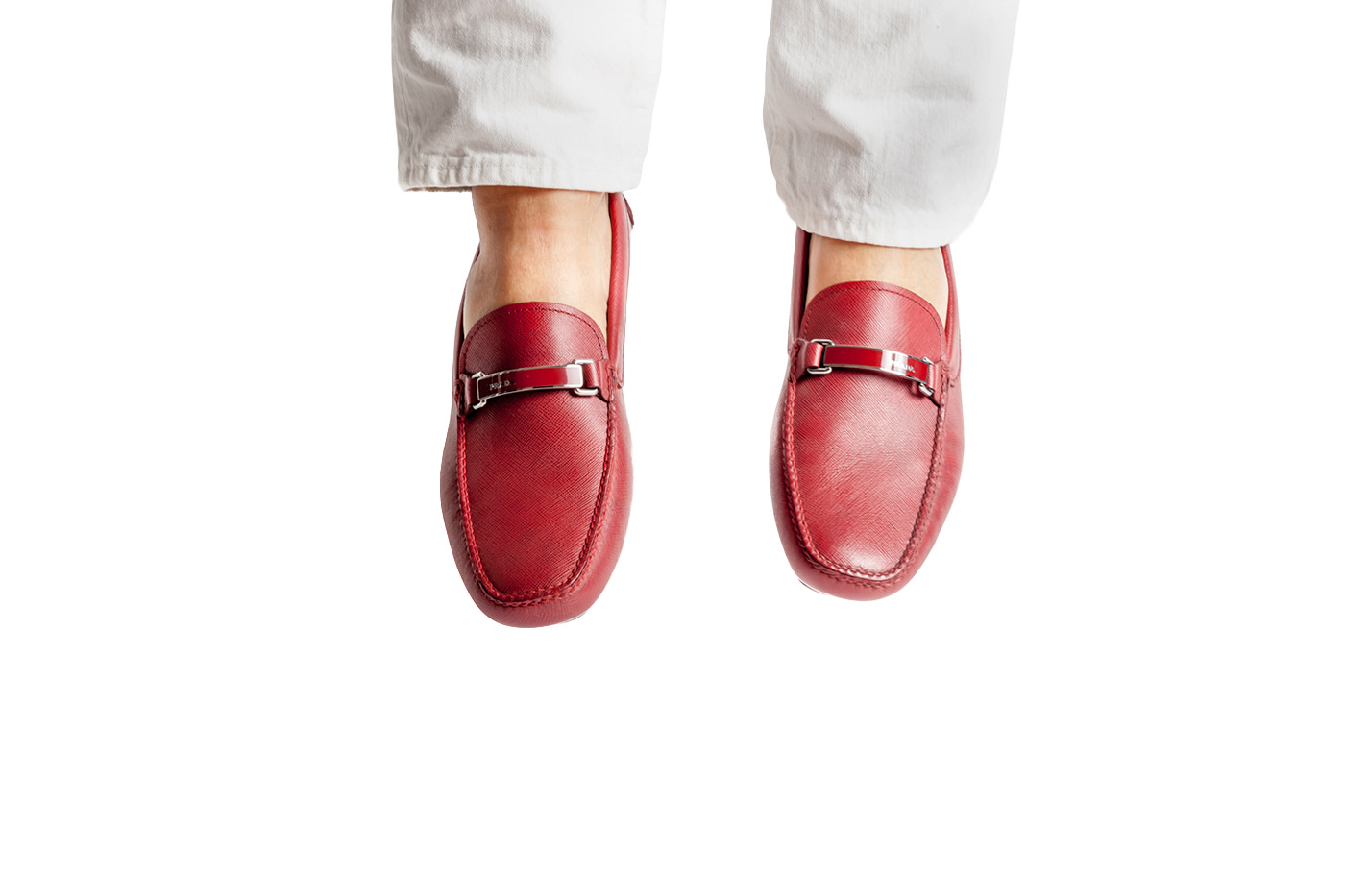 Red leather loafers product photography
